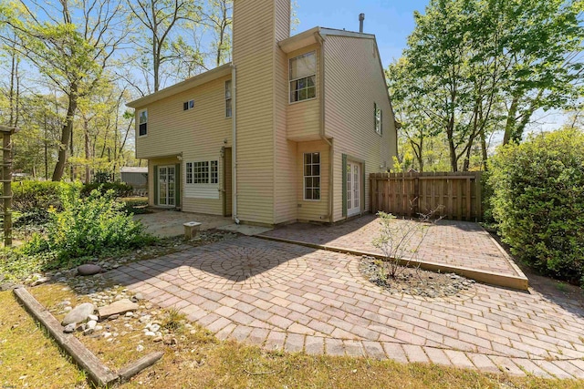 711 Falcon Crest Pl, Smithville, NJ 08205 - back of property with a patio, a chimney, and fence