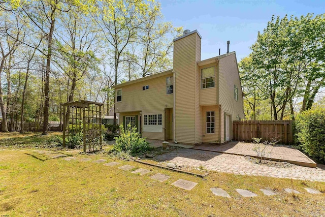 711 Falcon Crest Pl, Smithville, NJ 08205 - back of property with a chimney and a patio