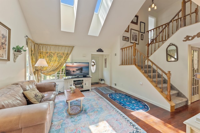 711 Falcon Crest Pl, Smithville, NJ 08205 - living area with high vaulted ceiling, a skylight, wood finished floors, stairway, and baseboards