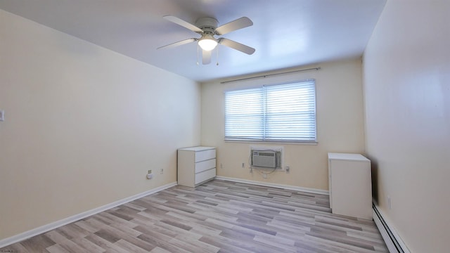 empty room with baseboard heating, a wall mounted air conditioner, light wood-style flooring, a ceiling fan, and baseboards