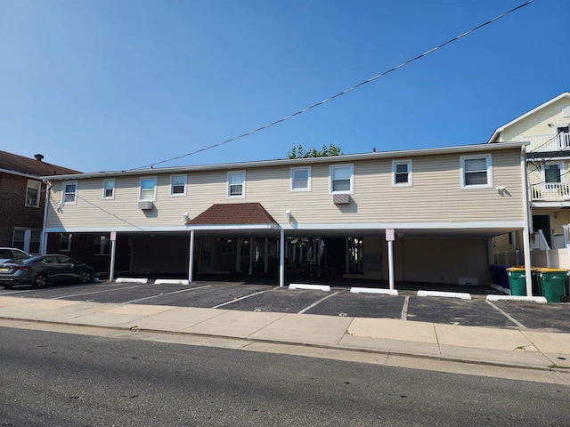 townhome / multi-family property with uncovered parking