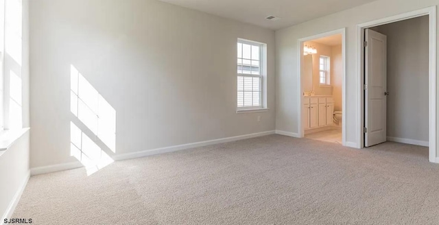 122 Hilton Ct, Egg Harbor Township, NJ 08234 - unfurnished bedroom featuring carpet, baseboards, and connected bathroom