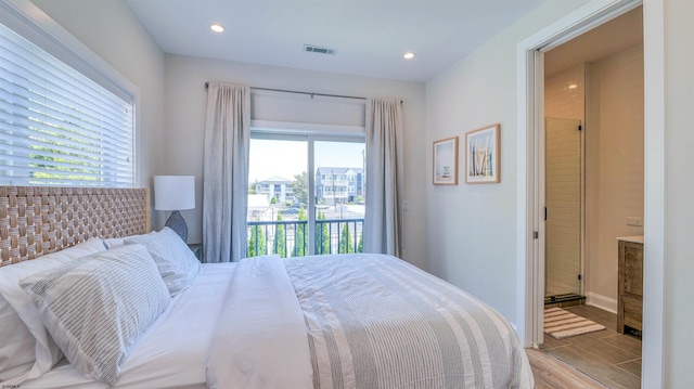 bedroom featuring multiple windows, access to exterior, recessed lighting, and visible vents