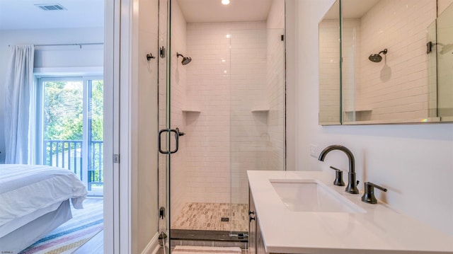 full bathroom featuring visible vents, recessed lighting, a stall shower, and vanity