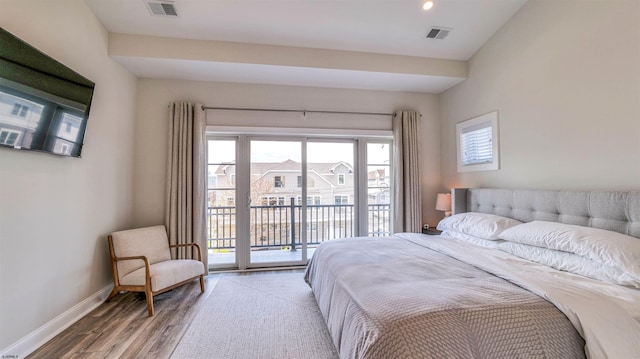 bedroom with visible vents, baseboards, access to outside, and light wood-type flooring