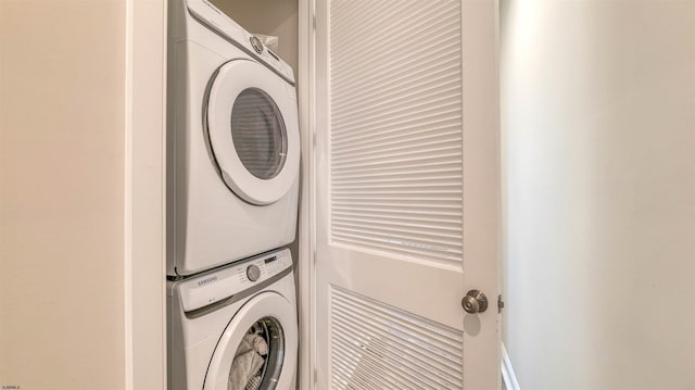 laundry area featuring laundry area and stacked washer / dryer