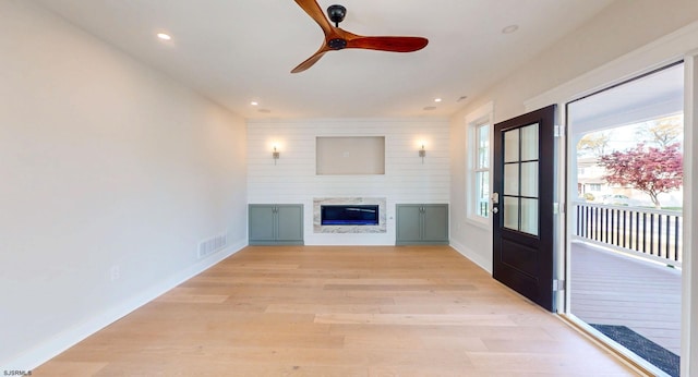 933 Oak Grv, Linwood, NJ 08221 - unfurnished living room with a ceiling fan, visible vents, baseboards, light wood finished floors, and a premium fireplace