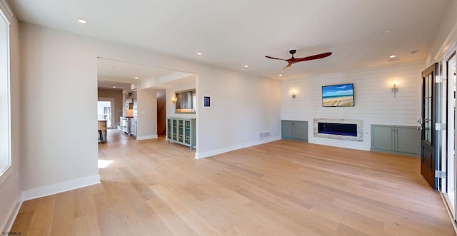 933 Oak Grv, Linwood, NJ 08221 - unfurnished living room with ceiling fan, a glass covered fireplace, light wood-style flooring, recessed lighting, and baseboards