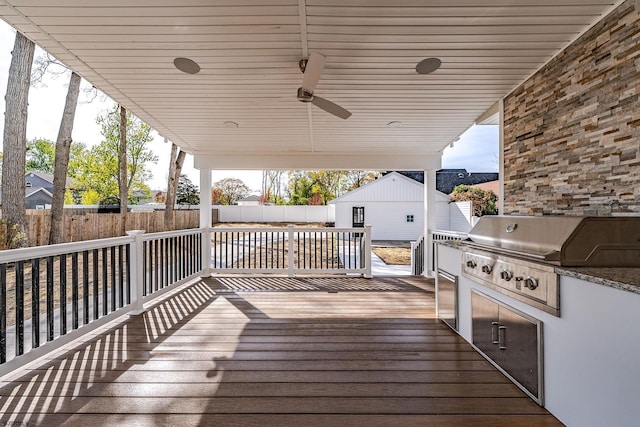933 Oak Grv, Linwood, NJ 08221 - wooden terrace with a fenced backyard, a ceiling fan, grilling area, and an outdoor kitchen