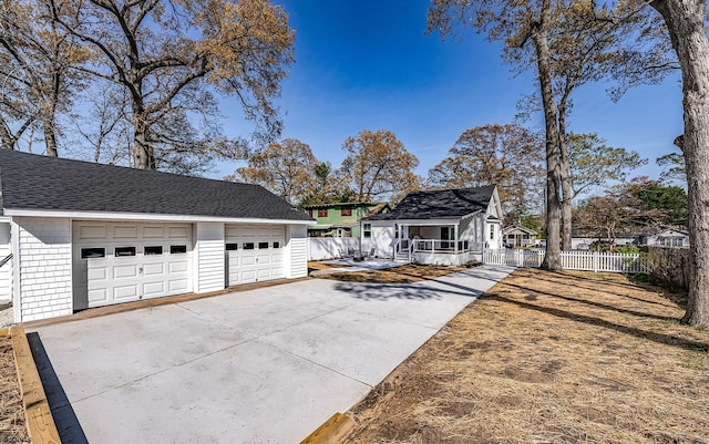 933 Oak Grv, Linwood, NJ 08221 - view of front of property with fence, a shingled roof, a garage, a porch, and an outdoor structure