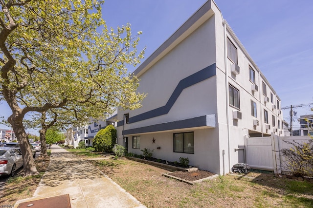921 Wesley Ave Unit B21, Ocean City, NJ 08226 - view of property exterior featuring fence, a gate, and stucco siding