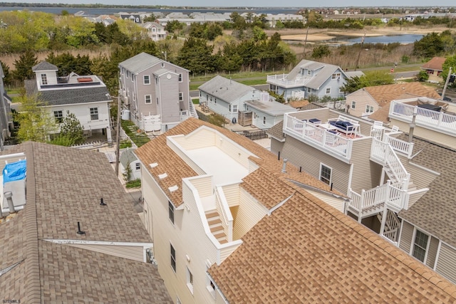 birds eye view of property featuring a water view and a residential view