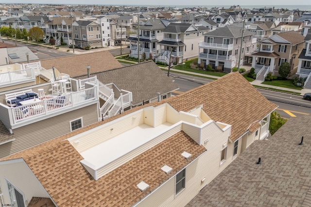 birds eye view of property with a residential view