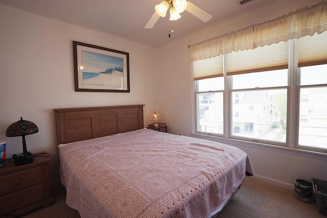 bedroom featuring baseboards and carpet flooring