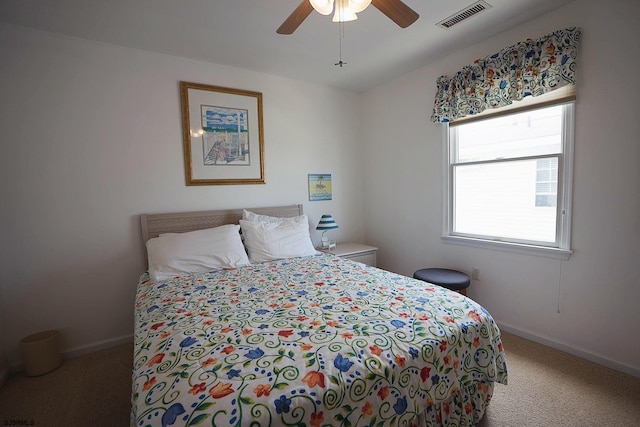 bedroom featuring baseboards, ceiling fan, carpet flooring, and visible vents
