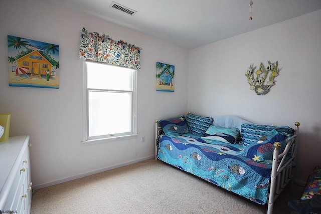 carpeted bedroom with baseboards and visible vents