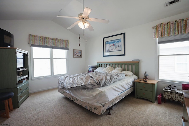 bedroom featuring light colored carpet, ceiling fan, visible vents, and lofted ceiling
