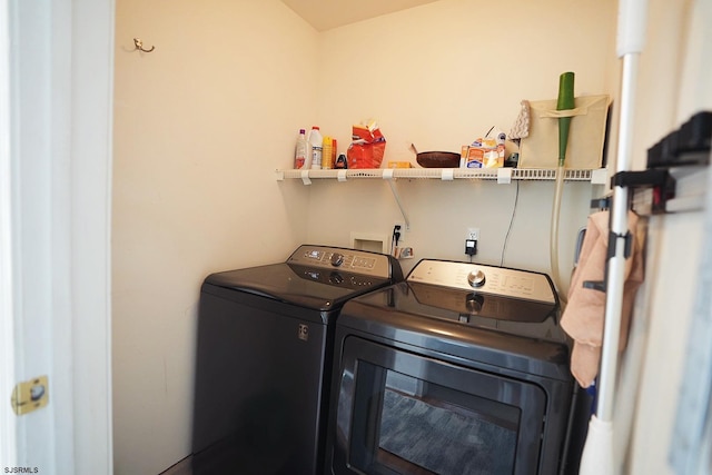 clothes washing area featuring laundry area and washer and dryer