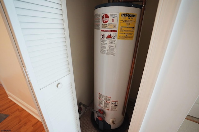 utility room featuring water heater