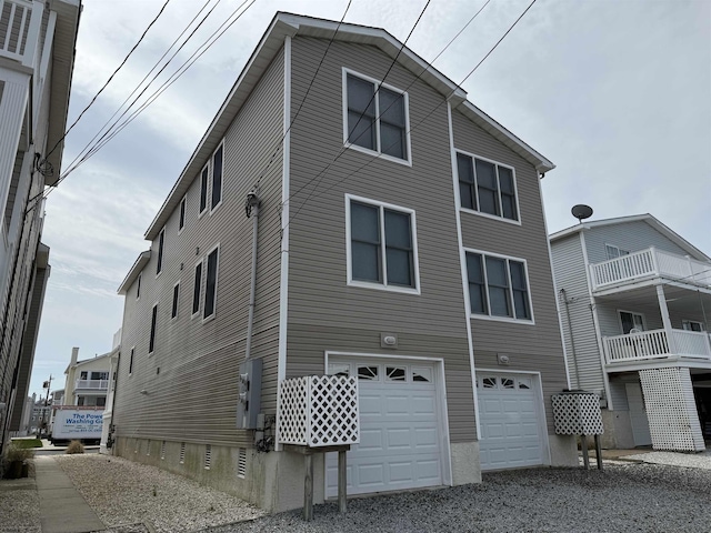 exterior space featuring an attached garage and driveway