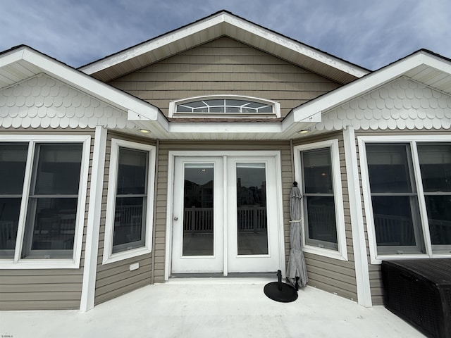 entrance to property featuring french doors and a patio