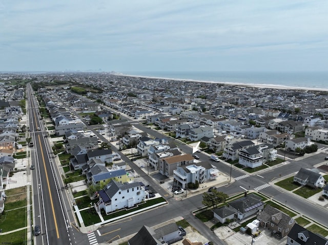birds eye view of property with a residential view and a water view