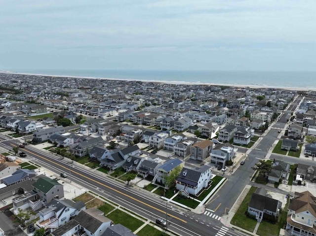 bird's eye view featuring a water view and a residential view