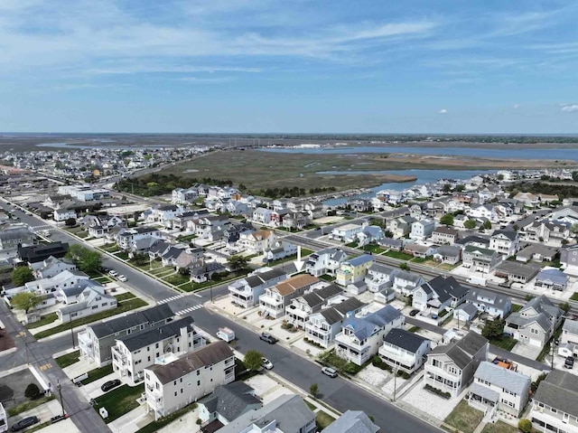 bird's eye view with a residential view and a water view
