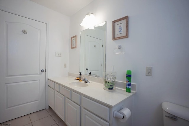 bathroom featuring tile patterned floors, vanity, and toilet