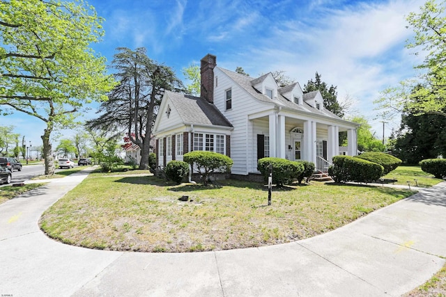 350 S Edgeley Ave, Pleasantville, NJ 08232 - view of home's exterior with a yard, a chimney, and covered porch
