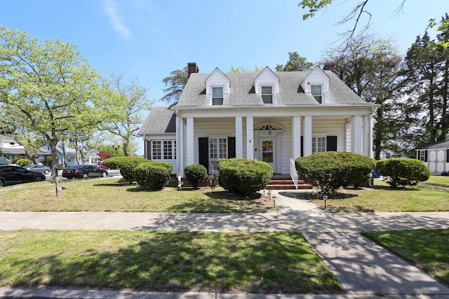 350 S Edgeley Ave, Pleasantville, NJ 08232 - cape cod-style house featuring a shingled roof, a front lawn, and a chimney