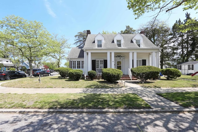 350 S Edgeley Ave, Pleasantville, NJ 08232 - cape cod home featuring a chimney, a front yard, roof with shingles, and covered porch