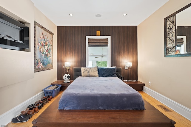 bedroom featuring recessed lighting, baseboards, visible vents, and wood finished floors