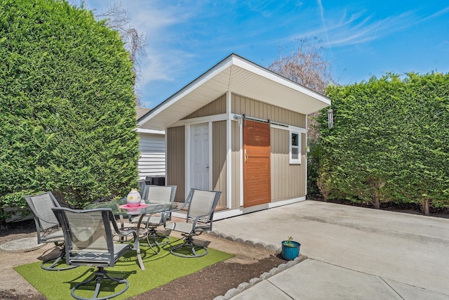 view of outbuilding with an outbuilding and outdoor dining space