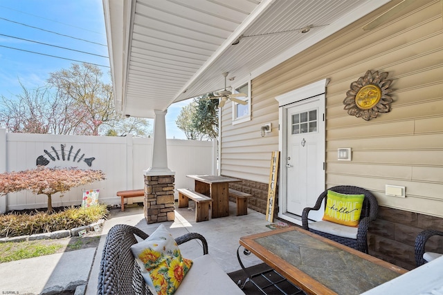 view of patio / terrace featuring fence