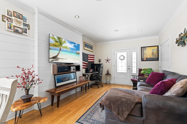 living room featuring crown molding, light wood-style floors, and recessed lighting