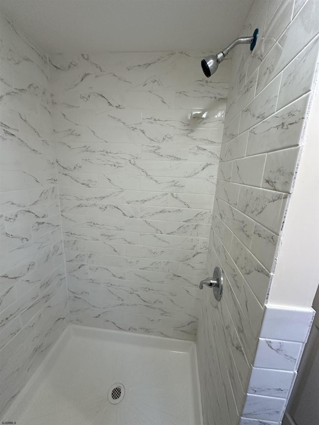 bathroom featuring a shower stall