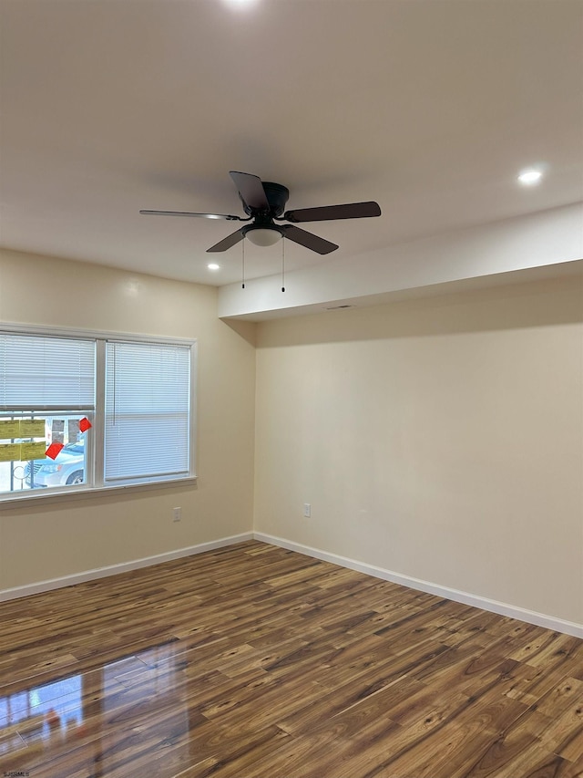 unfurnished room with dark wood finished floors, baseboards, ceiling fan, and recessed lighting