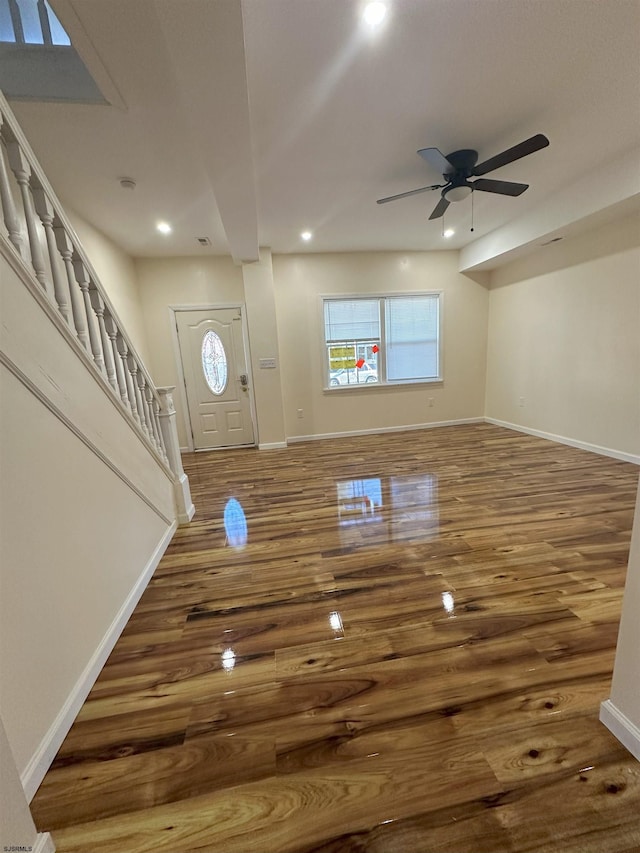 foyer entrance with recessed lighting, baseboards, ceiling fan, stairs, and wood finished floors