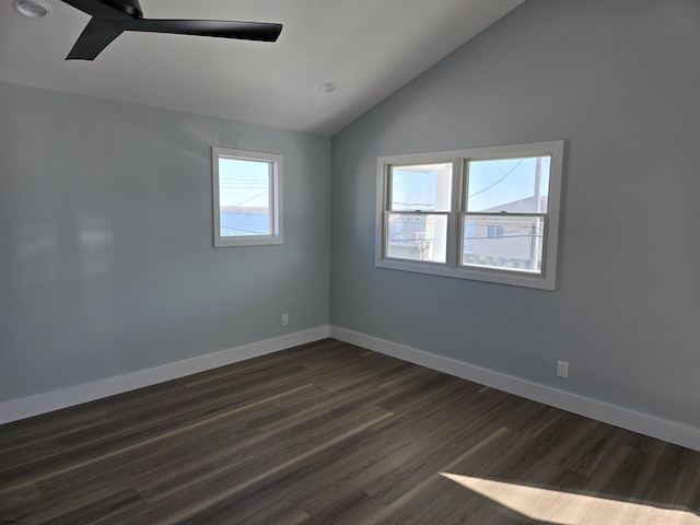 spare room with recessed lighting, vaulted ceiling, dark wood-style flooring, a ceiling fan, and baseboards