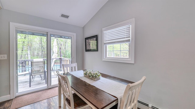 411 Spencer Ln, Galloway Township, NJ 08205 - dining room featuring vaulted ceiling, light wood finished floors, and baseboards