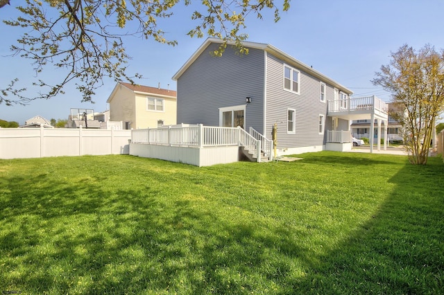 rear view of property featuring a deck