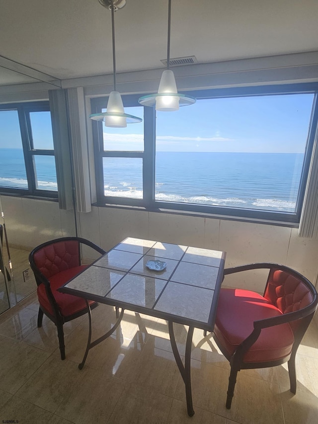 dining room with a water view