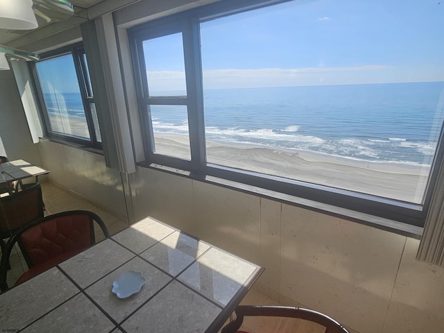 dining room featuring a water view