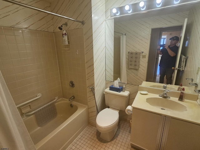 full bath featuring tile patterned flooring, bathtub / shower combination, toilet, and vanity
