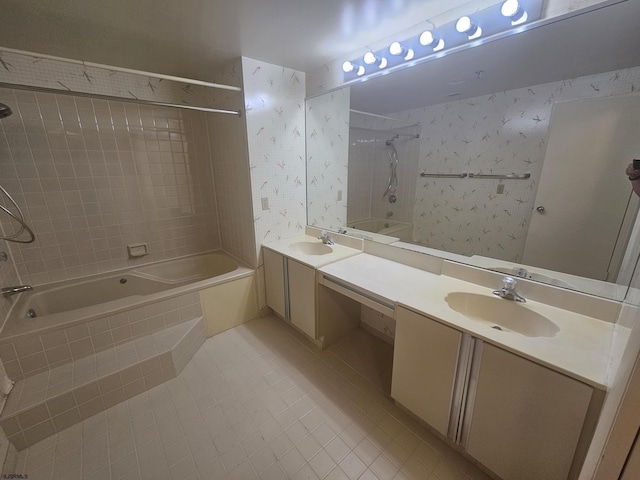 full bath with tiled shower / bath, tile patterned floors, and double vanity