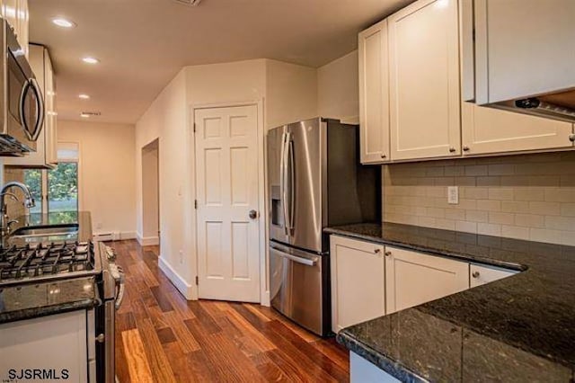 862 Central Ave, Hammonton, NJ 08037 - kitchen featuring stainless steel appliances, a sink, dark wood-style floors, white cabinets, and dark stone counters