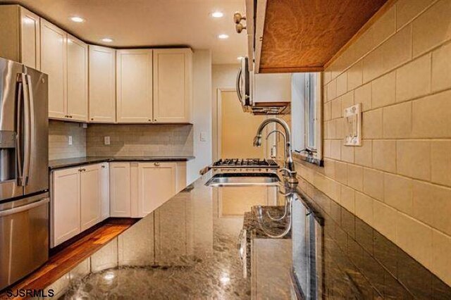 862 Central Ave, Hammonton, NJ 08037 - kitchen with appliances with stainless steel finishes, a sink, tasteful backsplash, recessed lighting, and white cabinets