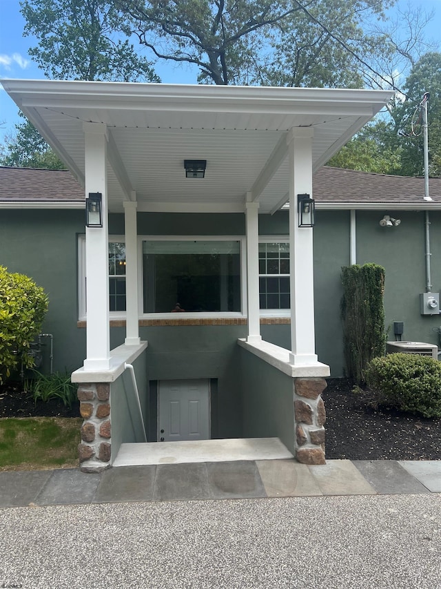 862 Central Ave, Hammonton, NJ 08037 - view of exterior entry featuring stucco siding and a shingled roof