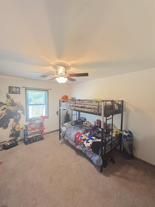 bedroom with carpet floors, ceiling fan, and baseboards
